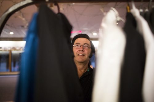 Gil White, or "Gilvis," hangs up his costumes at the Elvis Festival in Gimli on Saturday, Aug. 8, 2015.    Mikaela MacKenzie / Winnipeg Free Press