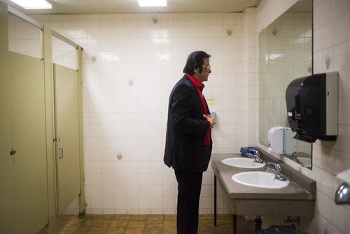 Gerry "The Big Bear" Barrett, the only aboriginal Elvis at the show, takes a look in the mirror at the Elvis Festival in Gimli on Saturday, Aug. 8, 2015.    Mikaela MacKenzie / Winnipeg Free Press