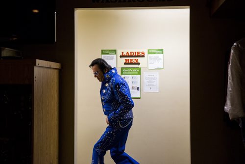 Gerry "The Big Bear" Barrett, the only aboriginal Elvis at the show, makes a grand exit from the washroom at the Elvis Festival in Gimli on Saturday, Aug. 8, 2015.    Mikaela MacKenzie / Winnipeg Free Press