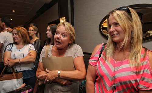 Janice Michnowicz (left) and Pam Monaghan (right) in the line that weaves back and forth inside the conference level for the casting call at Fairmont Sunday for a movie starring Dennis Quaid, Peggy Lipton and Britt Robertson. 150809 August 09, 2015 MIKE DEAL / WINNIPEG FREE PRESS