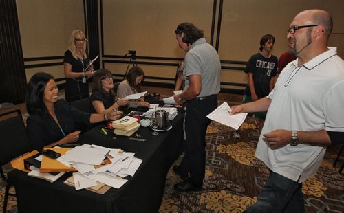 The moment everyone in line is waiting for, the casting table. Way over 2,000 hopeful extras stood in line during a casting call at Fairmont Sunday for a movie starring Dennis Quaid, Peggy Lipton and Britt Robertson. 150809 August 09, 2015 MIKE DEAL / WINNIPEG FREE PRESS