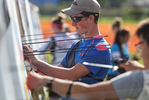 Dawson Williams from Prince George B.C. adds up his points during an elimination round of the Canada Open at the Canadian Archery Championships in Winnipeg. Over two hundred competitors from across the country took part in the championship which finished Sunday.  150809 August 09, 2015 MIKE DEAL / WINNIPEG FREE PRESS