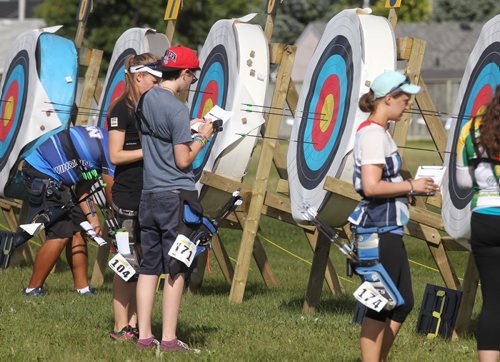 Archers add up their points during an elimination round of the Canada Open at the Canadian Archery Championships in Winnipeg. Over two hundred competitors from across the country took part in the championship which finished Sunday.  150809 August 09, 2015 MIKE DEAL / WINNIPEG FREE PRESS