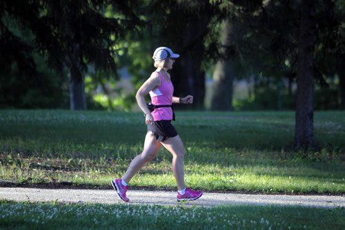 An unnamed jogger trots along Chirchill Drive Park near osborne. BORIS MINKEVICH/WINNIPEG FREE PRESS August 10, 2015