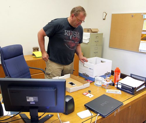 Peter Bjornson packs up his office at the Leg. Hes handed in his resignation papers to the Speaker and is quitting, as of today, as the MLA for Gimli. Hes also wearing a nifty Rush T-shirt and shorts, looking comfortable with his decision. BORIS MINKEVICH/WINNIPEG FREE PRESS August 10, 2015