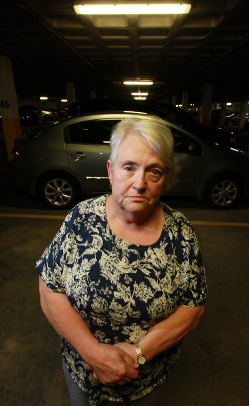 Christiane Leroux - grandmother who was knocked out with the butt end of a shotgun in a 2013 assault poses in the parking garage where she was found unconcious after thieves stole her car. See Mike MacIntyre story. August 10, 2015 - (Phil Hossack / Winnipeg Free Press)