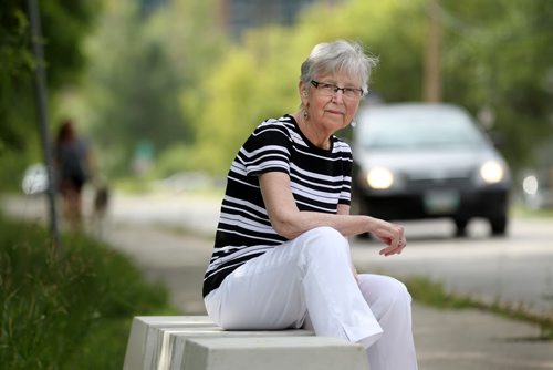 Helen Flint, an older resident in Old St. Vital sits on concrete blocks on Des Meurons that will be the new location for the post office boxes in her neighbourhood.  Flint and other residents in the area tried to make a formal complaint to Canada post for its initial location on the west side of Des Meurons because it was extremely hazardous due to heavy traffic in the area.  Her complaint went on deaf ears until the she contacted a reporter at the Free Press which questioned Canada Post which caused them to change their location for the boxes to a more suitable location for residents.   See story. Aug 11, 2015 Ruth Bonneville / Winnipeg Free Press