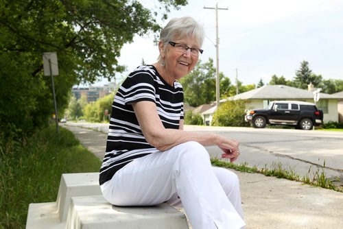 Helen Flint, an older resident in Old St. Vital is all smiles as sits on concrete blocks on Des Meurons that will be the new location for the post office boxes in her neighbourhood after winning a battle with Canada Post on its initial location.  Flint and other residents in the area tried to make a formal complaint to Canada post for its initial location on the west side of Des Meurons because it was extremely hazardous due to heavy traffic in the area.  Her complaint went on deaf ears until the she contacted a reporter at the Free Press which questioned Canada Post which caused them to change their location for the boxes to a more suitable location for residents.   See story. Aug 11, 2015 Ruth Bonneville / Winnipeg Free Press