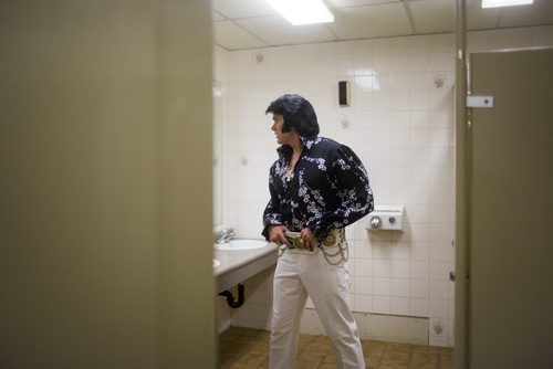 Elvis impersonator Corny Rempel transforms from his regular self to his stage persona through makeup, a wig, and classic outfits at a show at the Elvis Festival in Gimli on Sunday, Aug. 9, 2015. Mikaela MacKenzie / Winnipeg Free Press