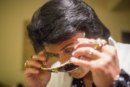 Elvis impersonator Corny Rempel transforms from his regular self to his stage persona through makeup, a wig, and classic outfits at a show at the Elvis Festival in Gimli on Sunday, Aug. 9, 2015. Mikaela MacKenzie / Winnipeg Free Press
