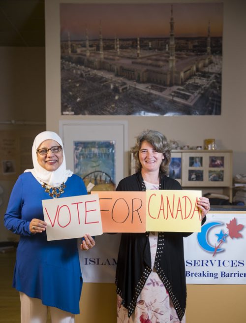 Shahina Siddiqui (left) and Irene McConachy of the Islamic Social Services Association support voting in Winnipeg on Tuesday, Aug. 11, 2015.   Mikaela MacKenzie / Winnipeg Free Press