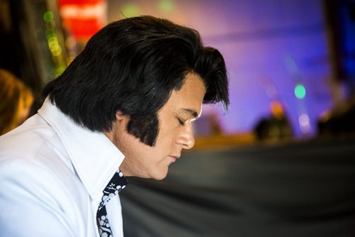 Elvis impersonator Corny Rempel takes a moment before going on stage at the Elvis Festival in Gimli on Sunday, Aug. 9, 2015.   Mikaela MacKenzie / Winnipeg Free Press