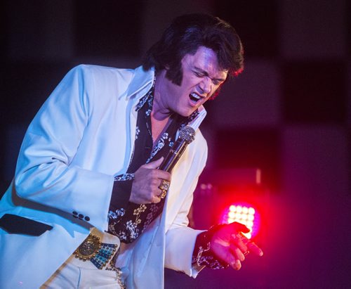 Elvis impersonator Corny Rempel gives it his all up on stage during his show at the Elvis Festival in Gimli on Sunday, Aug. 9, 2015.   Mikaela MacKenzie / Winnipeg Free Press