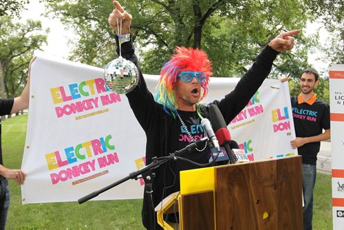 John Ford, organizer for this year's Electric Donkey Run, announces that the 5K glow party at night run will be taking place alongside this year's 5th annual ManyFest (Sept 11-13) at a press conference for ManyFest on Broadway Tuesday.    Aug 11, 2015 Ruth Bonneville / Winnipeg Free Press