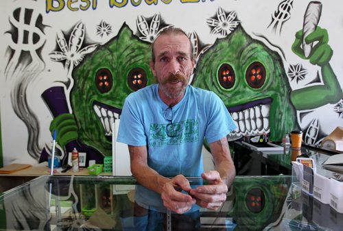Glenn Price, owner of a medical marijuana shop says his wrists are still swollen from being handcuffed after his recent arrest.   See Ashley Prest story.  Aug 11, 2015 Ruth Bonneville / Winnipeg Free Press