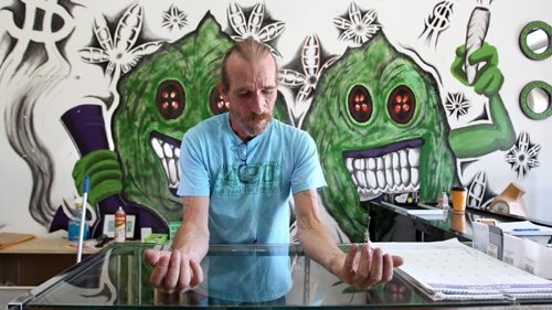 Glenn Price, owner of a medical marijuana shop says his wrists are still swollen from being handcuffed after his recent arrest.   See Ashley Prest story.  Aug 11, 2015 Ruth Bonneville / Winnipeg Free Press