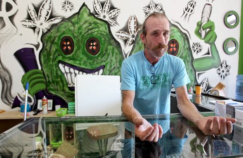 Glenn Price, owner of a medical marijuana shop says his wrists are still swollen from being handcuffed after his recent arrest.   See Ashley Prest story.  Aug 11, 2015 Ruth Bonneville / Winnipeg Free Press