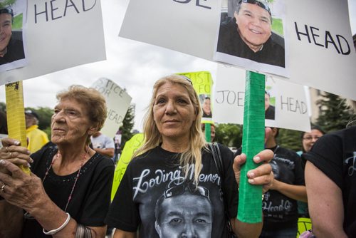 Valerie Head (centre), wife of Joe Head, and her mother Bertha Gofflot (left), protest to bring attention to problems with flood channels at the Manitoba Legislative Building in Winnipeg on Wednesday, Aug. 12, 2015.   Mikaela MacKenzie / Winnipeg Free Press
