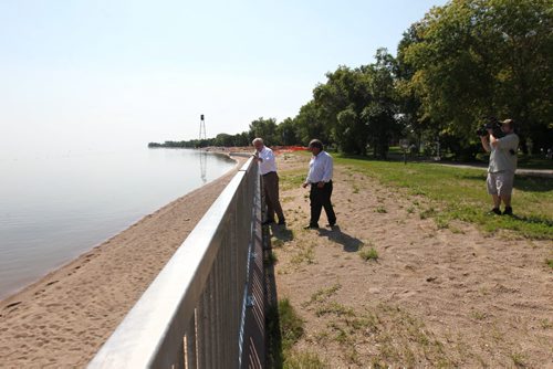 Manitoba Premier Greg Selinger and Wpg Beach Mayor Tony Pimente walk along Wpg Beach next to seawall that will be extended to the southern portion of the beachfront after  new funding announced at press conference announced Thursday at Winnipeg Beach.  TOPIC: New funding for seawall repairs in Winnipeg Beach    See Aidan Geary story.  Aug 13, 2015 Ruth Bonneville / Winnipeg Free Press
