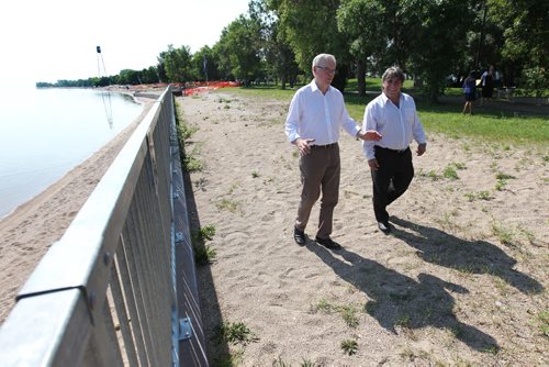 Manitoba Premier Greg Selinger and Wpg Beach Mayor Tony Pimente walk along Wpg Beach next to seawall that will be extended to the southern portion of the beachfront after  new funding announced at press conference announced Thursday at Winnipeg Beach.  TOPIC: New funding for seawall repairs in Winnipeg Beach    See Aidan Geary story.  Aug 13, 2015 Ruth Bonneville / Winnipeg Free Press