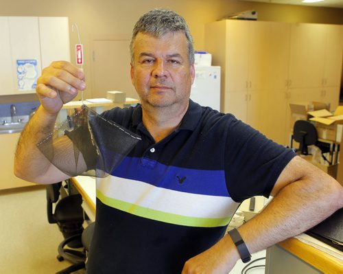 Ken Nawolsky, City of Winnipeg superintendent of insect control, does an update on testing results on DeltaGard, a new organic treatment to replace malathion. Photo taken at Public works yard, 1539 Waverley. He holds a test cage that weill be used in the trials of the product as early as next week. BORIS MINKEVICH / WINNIPEG FREE PRESS PHOTO August 13, 2015