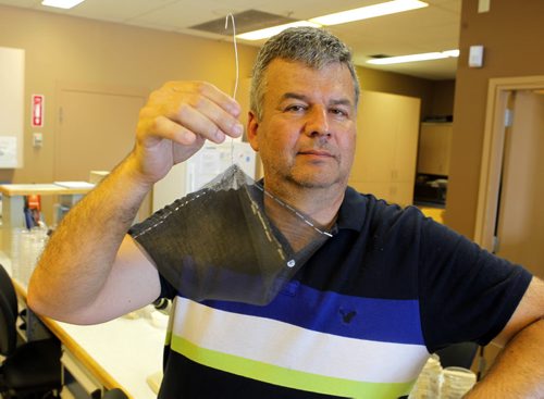 Ken Nawolsky, City of Winnipeg superintendent of insect control, does an update on testing results on DeltaGard, a new organic treatment to replace malathion. Photo taken at Public works yard, 1539 Waverley. He holds a test cage that weill be used in the trials of the product as early as next week. BORIS MINKEVICH / WINNIPEG FREE PRESS PHOTO August 13, 2015