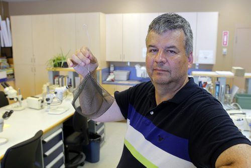 Ken Nawolsky, City of Winnipeg superintendent of insect control, does an update on testing results on DeltaGard, a new organic treatment to replace malathion. Photo taken at Public works yard, 1539 Waverley. He holds a test cage that weill be used in the trials of the product as early as next week. BORIS MINKEVICH / WINNIPEG FREE PRESS PHOTO August 13, 2015