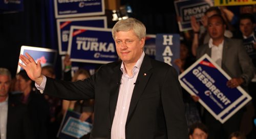 Prime Minister STEPHEN HARPER salutes the crowd at a party rally held in Winnipeg Thursday afternoon. About 200 party faithful packed a small room at a local hotel. There were no public attndees. See story. August 13,2015 - (Phil Hossack / Winnipeg Free Press)