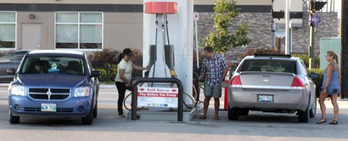 Consumers fill up at a local gas bar Thursday....Gas Prices, See story. August 13,2015 - (Phil Hossack / Winnipeg Free Press)