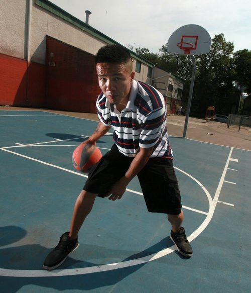 Leonard Monkman,dribble a basketball on the outdoor courts at Elias Magnusson Community Center Friday. See Melessa Matin's story. August 14, 2015 - (Phil Hossack / Winnipeg Free Press)