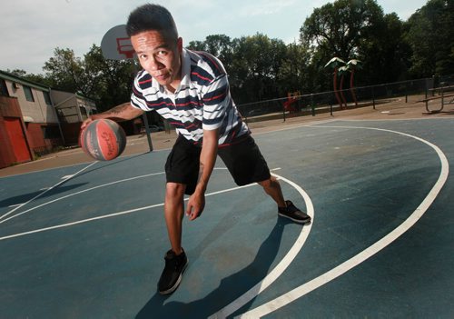 Leonard Monkman,dribble a basketball on the outdoor courts at Elias Magnusson Community Center Friday. See Melessa Matin's story. August 14, 2015 - (Phil Hossack / Winnipeg Free Press)