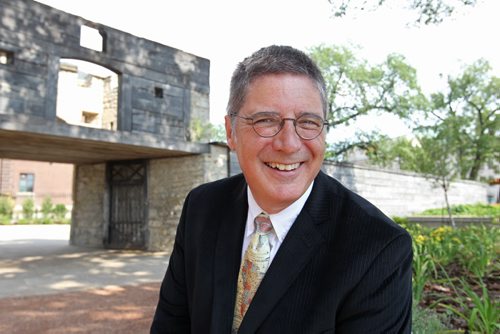Jimm Simon Executive Director,  Friends of Upper Fort Garry, is all smiles as he poses in front of the gate after the official unveiling of Upper Fort Garry  at the new provincial park on Main street Friday.   Aug 14, 2015 Ruth Bonneville / Winnipeg Free Press