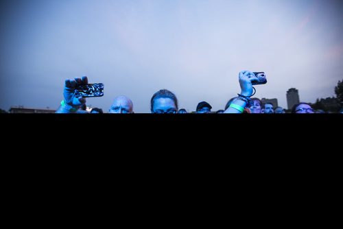 Fans take pictures as Sarah McLachlan sings at the Interstellar Rodeo at the Forks in Winnipeg on Friday, Aug. 14, 2015.   Mikaela MacKenzie / Winnipeg Free Press