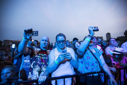 Fans take pictures as Sarah McLachlan sings at the Interstellar Rodeo at the Forks in Winnipeg on Friday, Aug. 14, 2015.   Mikaela MacKenzie / Winnipeg Free Press