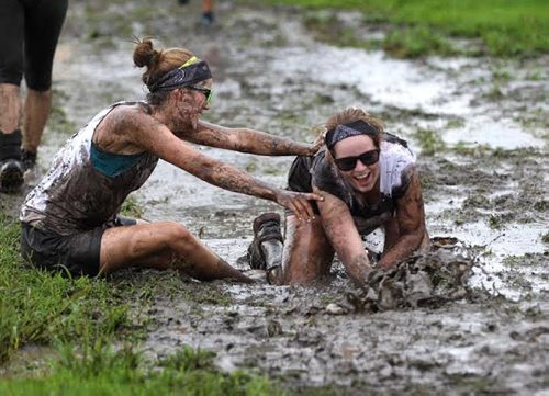 Participants take part in the Dirty Donkey Mud Run at Assiniboine Downs Saturday.  August  15, 2015 Ruth Bonneville  Winnipeg Free Press