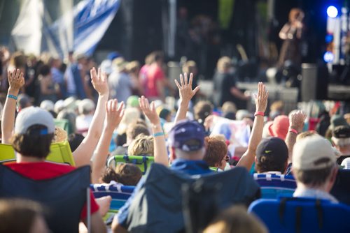 Fans put their hands in the air as Steve Earle plays at the Interstellar Rodeo in Winnipeg on Saturday, Aug. 15, 2015.   Mikaela MacKenzie / Winnipeg Free Press