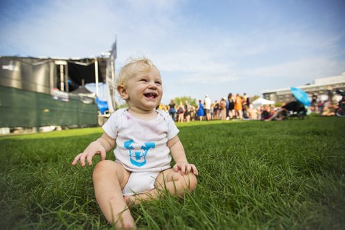 Jimi Doucet, one, plays in the grass at the Interstellar Rodeo in Winnipeg on Saturday, Aug. 15, 2015.   Mikaela MacKenzie / Winnipeg Free Press