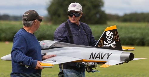 Len Gladstone (right) carries his turbine powered Flash model plane with the help of his spotter George Hall (left) at the Gimli Model Airplane Festival today. 150816 - Sunday, August 16, 2015 -  MIKE DEAL / WINNIPEG FREE PRESS