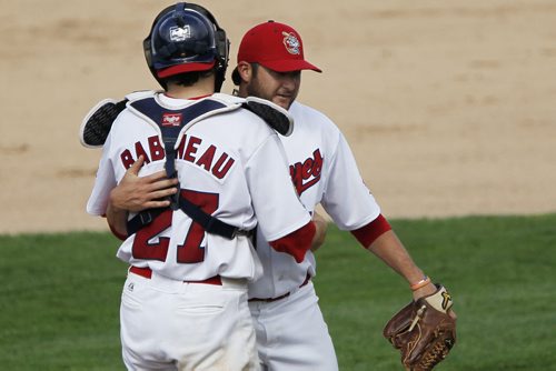 August 16, 2015 - 150816  -  Winnipeg Goldeyes catcher Ryan Babineau (27) and pitcher Brad Mincey congratulate each other after defeating the Fargo-Moorehead Red Hawks Sunday, August 16, 2015. John Woods / Winnipeg Free Press