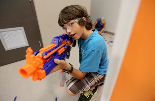 Isaac Taylor, 11, playing Dartpocalypse. For Dave Sanderson, Saturday, July 25, 2015. (TREVOR HAGAN/WINNIPEG FREE PRESS)