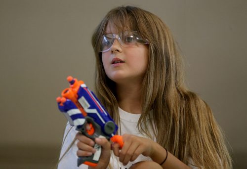 Allegra Stone, 8, playing Dartpocalypse. For Dave Sanderson, Saturday, July 25, 2015. (TREVOR HAGAN/WINNIPEG FREE PRESS)