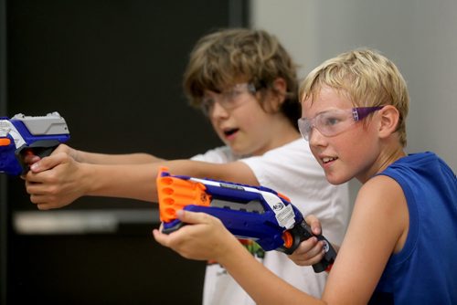 Elliot Stone, 11, and Josh Harder, 12, playing Dartpocalypse. For Dave Sanderson, Saturday, July 25, 2015. (TREVOR HAGAN/WINNIPEG FREE PRESS)