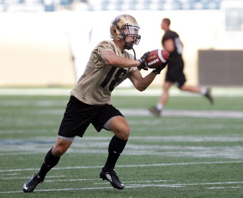 U of M slot back #18  Alex Vitt retrieves the ball on the IGF Monday. See story.  August 17, 2015 - (Phil Hossack / Winnipeg Free Press)