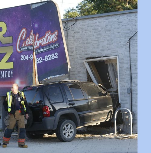 Winnipeg Fire Fighters at the scene on St. Mary's Road at Hull Ave. Tuesday morning after a SUV crashed into the side of the Keratin Care Nail,Skin and Hair salon. The driver was not injured.Wayne Glowacki / Winnipeg Free Press August 18 2015