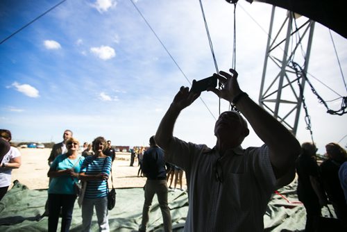 Visitors take pictures of the inside of the tent as Cavalia sets up their big top in Winnipeg on Tuesday, Aug. 18, 2015.   Mikaela MacKenzie / Winnipeg Free Press