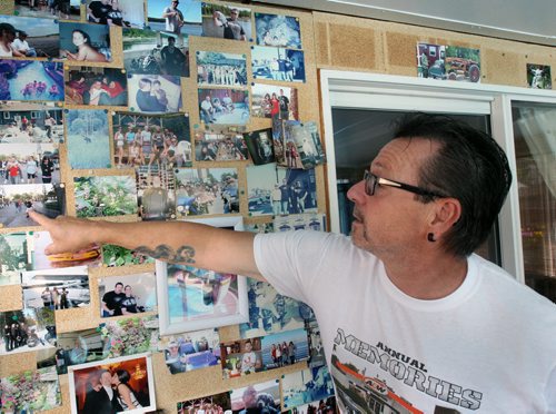 John Kolb lost his son Jessie Last-Kolb, 24 years to a Fentanyl overdose in July 2014   He  stands by photo mural in his home -See Katie May story- Aug 18, 2015   (JOE BRYKSA / WINNIPEG FREE PRESS)