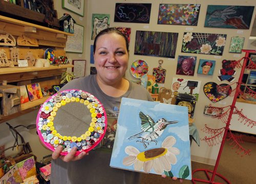 The Scrap Came Back at 153 St. Anne's Rd. Dara Finlay is one of the mentoring artists and poses in the gallery. BORIS MINKEVICH / WINNIPEG FREE PRESS PHOTO August 18, 2015
