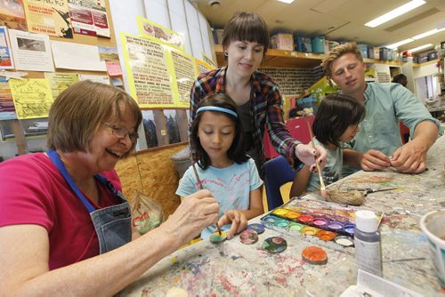 August 18, 2015 - 150818  -  Art City volunteers Debby Lake and Erin Senko with Studio manager/volunteer coordinator Today Gillies assist children to create some art from found objects Tuesday, August 18, 2015.  John Woods / Winnipeg Free Press