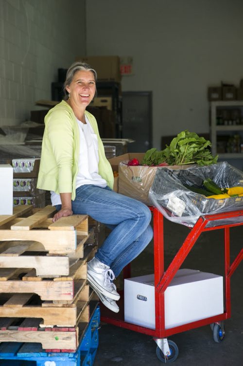 Marnie Feeleus, president of Fresh Option Organic Delivery, in her warehouse with fresh, local, and organic produce in Winnipeg on Wednesday, Aug. 19, 2015.   Mikaela MacKenzie / Winnipeg Free Press