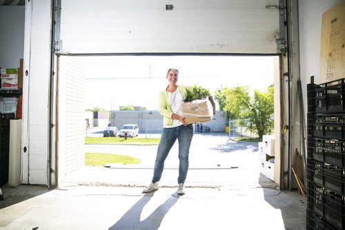 Marnie Feeleus, president of Fresh Option Organic Delivery, in her warehouse with fresh, local, and organic produce in Winnipeg on Wednesday, Aug. 19, 2015.   Mikaela MacKenzie / Winnipeg Free Press